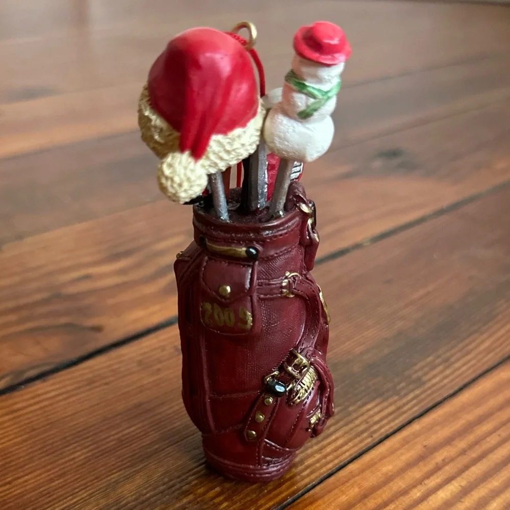2009 red golf bag ornament w Santa hat, snowman, & clubs